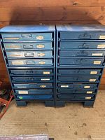Four blue metal parts cabinets arranged in 2x2 configuration