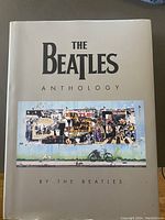 Front cover of 'The Beatles Anthology' coffee table book showing title and collage artwork.