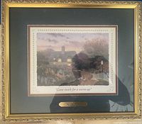 Full view of framed Thomas Kinkade print titled "Come Inside for a Warmup." Frame is gold ornate and print has a dark matte with a brass bar plaque below the image.