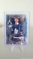 Front of Joseph Woll rookie hockey card featuring the player in Toronto Maple Leafs uniform.