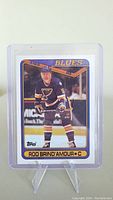 Front of Rod Brind'Amour 1990 Topps rookie hockey card showing him in St. Louis Blues uniform.