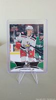 Front image of Tyler Bertuzzi rookie hockey card in protective case showing him playing with the Griffins team.
