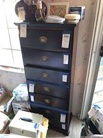 Front view of the wood 7-drawer lingerie chest dresser showing black finish and brass oval drawer pulls.