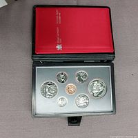 Open black leather case with red interior showing the 1979 Canadian proof coin set. Seven coins in protective display slots, including the copper one cent and various silver-toned coins.