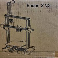Front of cardboard box showing Ender-3 V2 line drawing
