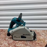 Side profile view showing Makita logo, brushless (BL) LXT 36V marking and dust port outlet