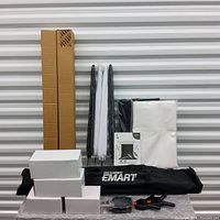 Full kit contents showing boxed items, stands, backdrops, clamps, and carrying bag.