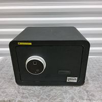 Photo of the black Traamic home safe showing front view with electronic dial lock and fingerprint scanner.