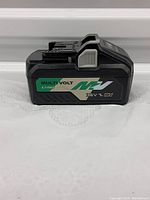 Side view of Metabo MultiVolt 36V 18V Li-ion battery with MultiVolt logo and specifications visible.