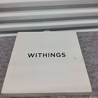 Closed white Withings branded box with black lettering.