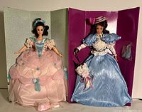 Two 1993 Great Eras Barbie dolls shown in inner packaging without outer boxes. Gibson Girl doll in pink dress and Southern Belle in blue.