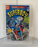Front cover of vintage Superboy comic book #454 featuring colorful superhero action scene with Superboy in blue suit flying, and other characters on cover.