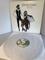 Open album cover featuring front artwork with band members on roller skates in black and white.