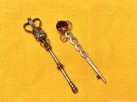 Pair of two pins on yellow fabric background showing full length and details