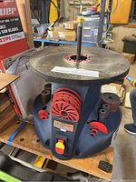 Front angled view of Central Machinery 14 inch oscillating spindle sander showing sanding table top, sanding discs mounted on spindles, and main power switch.