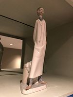 Side angle of the Lladro doctor porcelain figurine showing detailed posture and base.