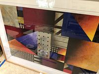 Full view of framed art leaning against wall, showing overall design and condition