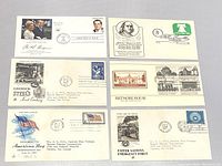 Front view of six first day issue envelopes showing different stamps, cancellation marks, and commemorative cachets on various historical topics.