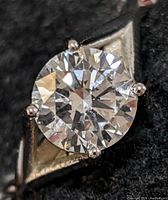 Top view close-up of round brilliant diamond showing facets and clarity