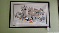 Full view of framed Disney 'Welcoming the new millennium 2000' serigraph showing various Disney characters and theme park icons.