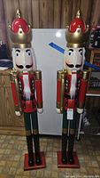 Front view of two large nutcracker figures standing side by side.