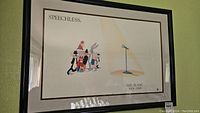 Full view of the framed artwork showing Looney Tunes characters grouped under 'SPEECHLESS.' and a microphone with Mel Blanc's dates.