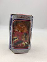 Original cardboard box labeled 'STAN'KA' featuring stars and stripes design and clear window showing the wobble doll inside.
