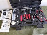 Open case showing all tools inside custom molded plastic carrying case and printed instructions.