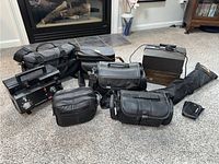 Overview of black carrying cases, Elmo K100 SM projector and tripod bag