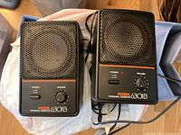 Two Fostex 6301B Personal Monitor speakers side by side showing front with power switch, volume knob, and metal grille.
