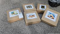 Five boxed Little Liberty classic wooden jigsaw puzzles for children arranged on carpet, showing front labels on each box.