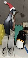 Painted wooden penguin decoration with scarf and six frosted penguin glasses