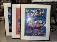 Three framed vintage Turk Murphy jazz band posters displayed together, showing artwork and frames.