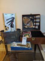 Full view of the wine accessories set including the leather carry case, lever model opener box, corkscrew, and metal ice bucket.