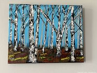 Front view of the acrylic painting showing birch trees with blue sky background, signed by Lee Cole.