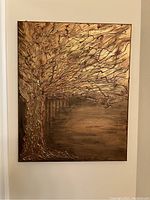 Front view of the golden tree painting showing textured branches and trunk with warm golden and brown tones.