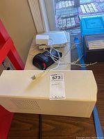 APC Back-UPS Pro power pack, Microtek SlimScan C scanner, and other electronic items shown on table.