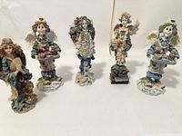 Five tall Boyd's Bears doll-like figurines arranged in a row, showing their front details.