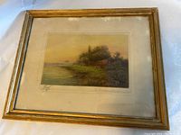 Framed signed and numbered landscape print with visible image and frame condition.