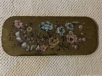 Full view of 9x21 inch rectangular beaded floral design on burlap and wood board with rounded edges