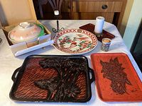 Overview of all items including trays, platter, lidded pot, and candle holders arranged on table