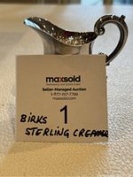 Front view of creamer with MaxSold sign