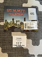 Label showing the rug is from Summit Collection, made in Turkey, 9x12 feet size, black and white color.