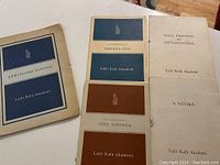 Various booklets or pamphlets related to Lalit Kala Akademi's Kishangarh Painting collection and Indian art themes, showing covers with titles and logos.