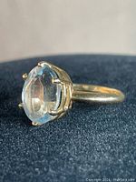 Front view of oval aquamarine ring on black background