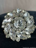 Close-up front photo of vintage Czecho rhinestone brooch showing detailed faceted clear stones in circular floral arrangement.