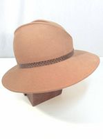 Side profile photo of the brown felt fedora-style hat showing braided band and smooth wide brim