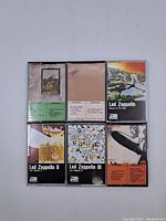 Top view of six vintage Led Zeppelin cassette tapes with visible album artwork