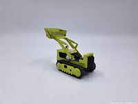 Image showing the left side of the vintage Tonka toy excavator with front bucket raised, yellow with black and silver details.