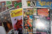 Set of assorted comic books from different publishers including DC, Marvel, Archie, and Star Comics arranged side by side displaying covers.